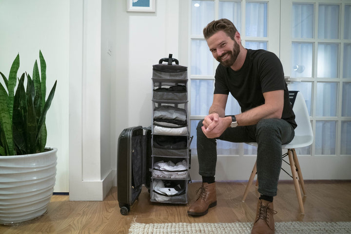 This suitcase is actually a carry-on closet that folds out into shelves