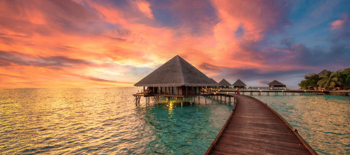 overwater bungalow during sunset